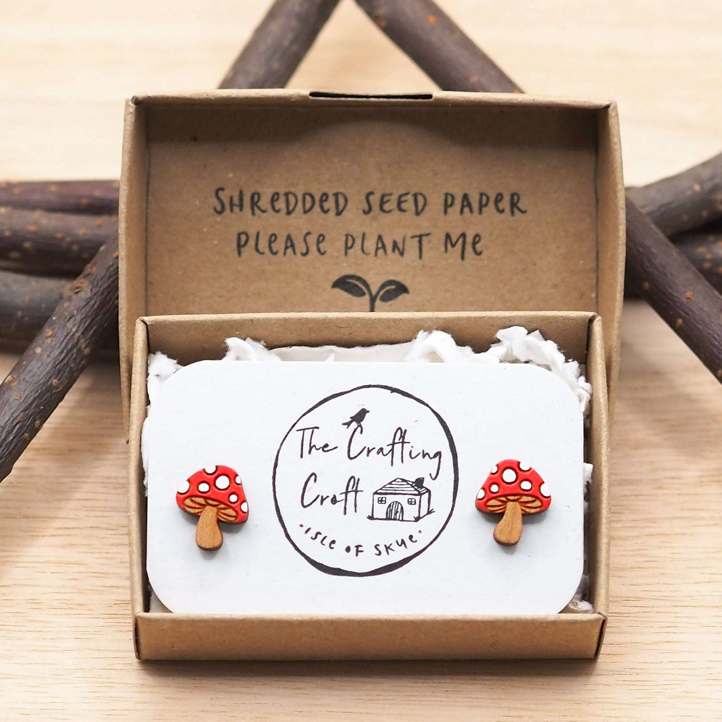 Hand-painted mushroom stud earrings made from cherry wood with red and white design in eco-friendly gift box.