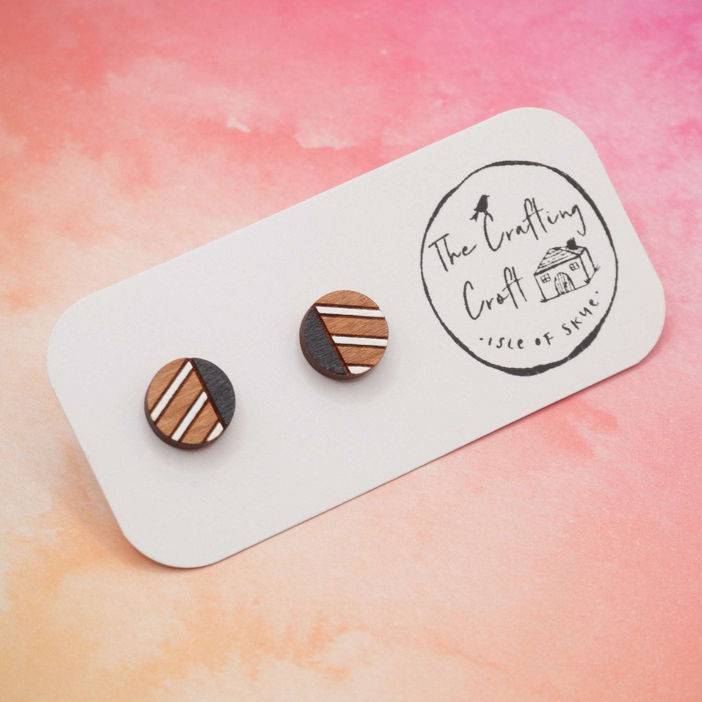 Monochrome geometric painted stud earrings on display card with eco-friendly gift packaging.