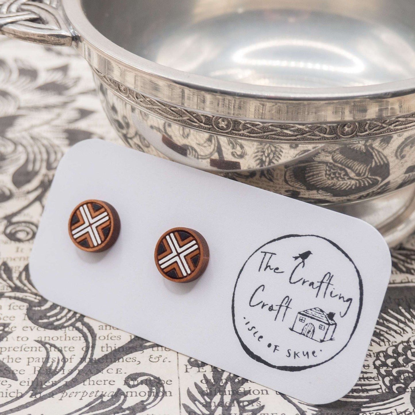 Black and white geometric painted studs on card with eco-friendly packaging.