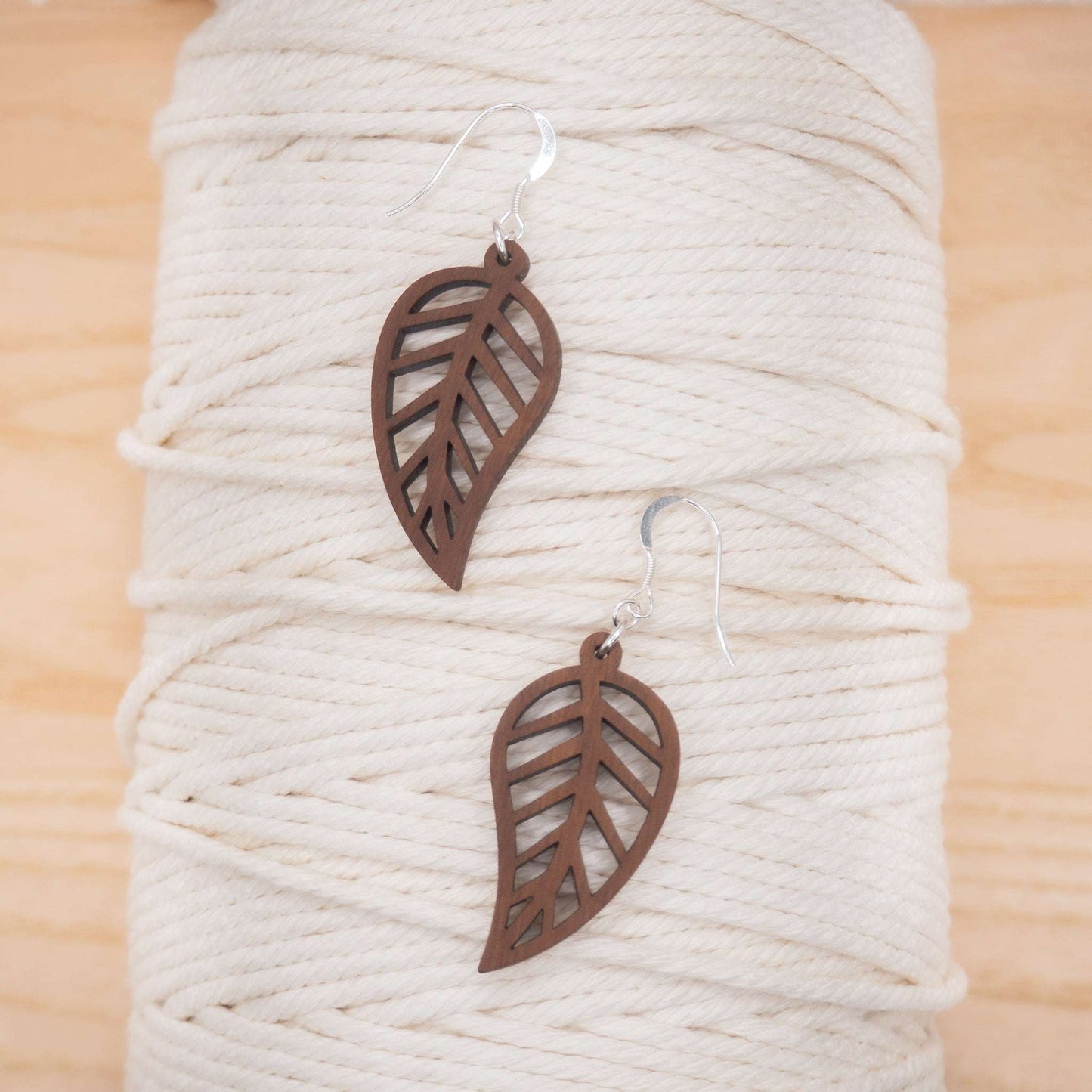 Leaf outline drop earrings solid walnut wood with recycled sterling silver hooks