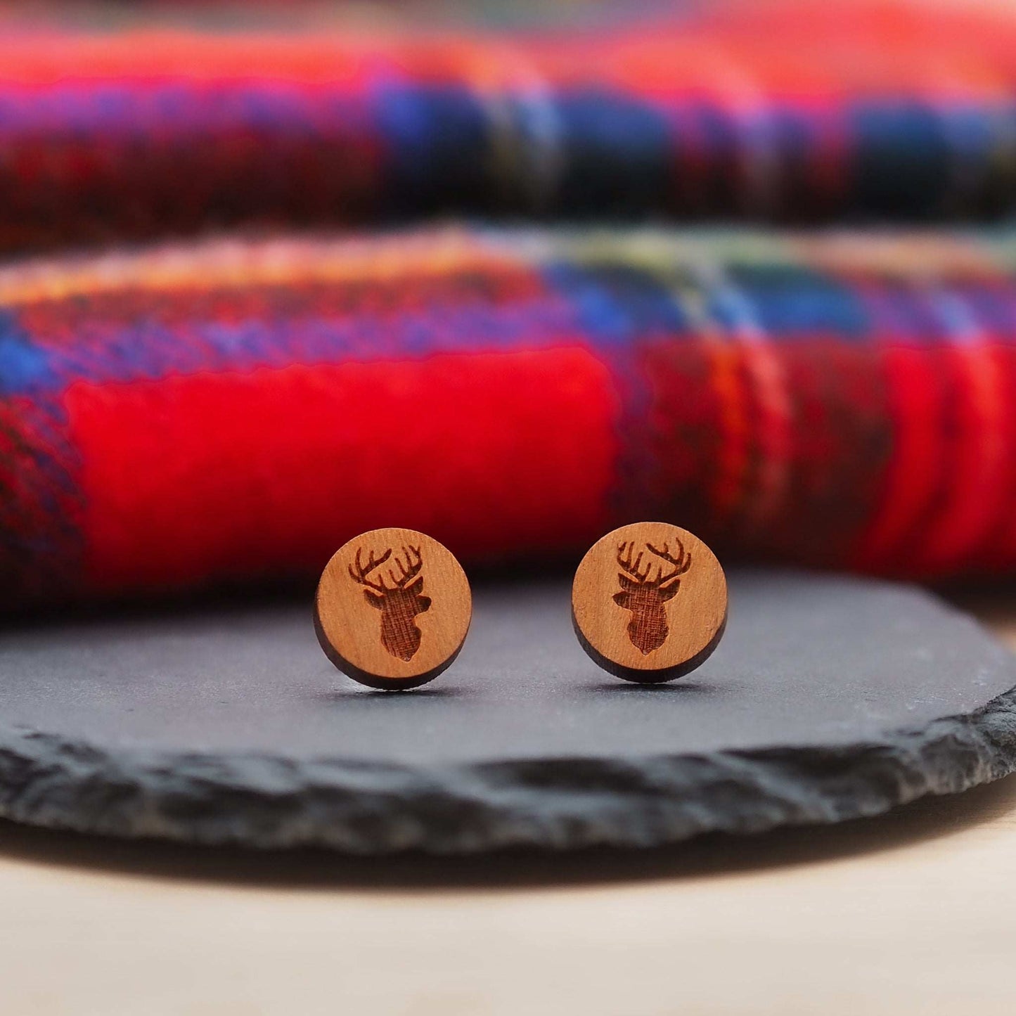 Stag head stud earrings made of cherry wood on slate, eco-friendly gift.