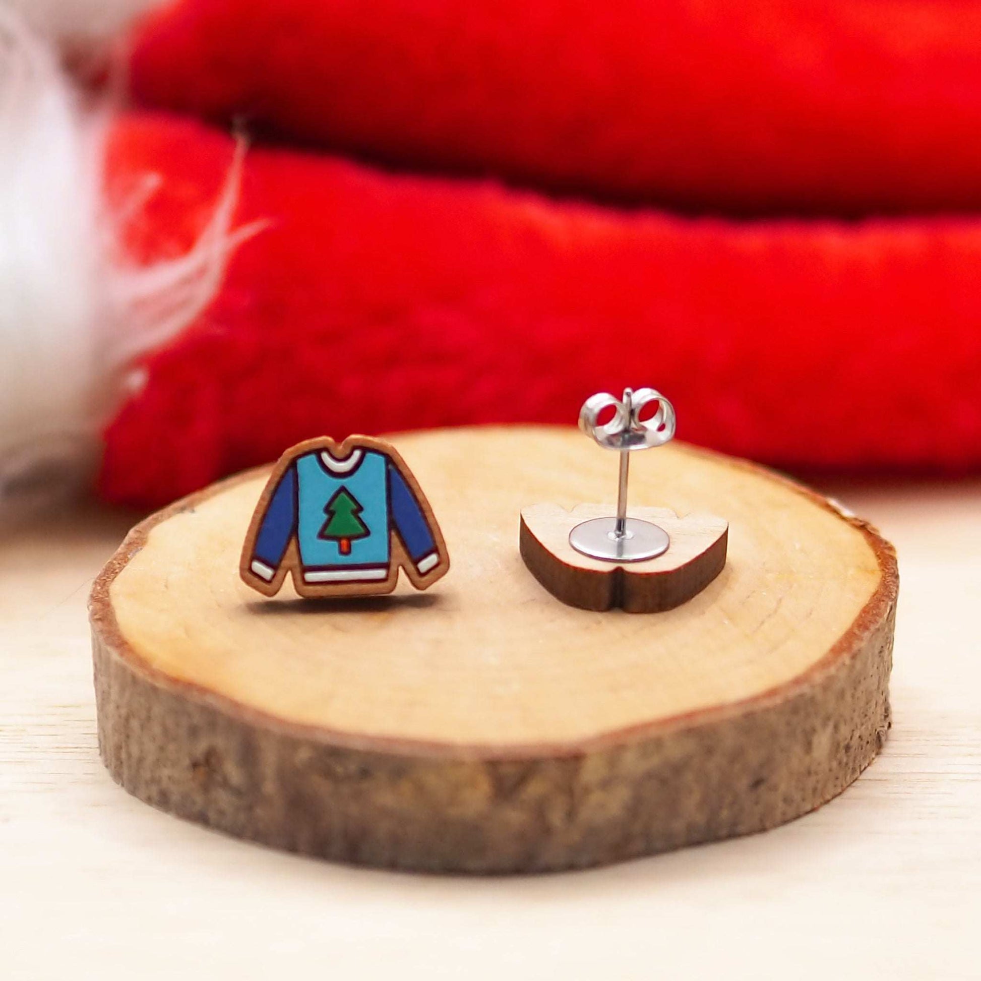 Christmas jumper stud earrings on cherry wood with eco-friendly gift box.