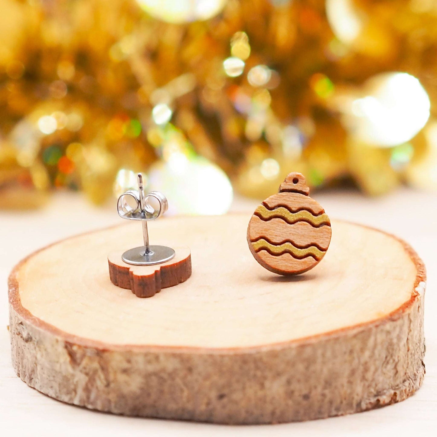 Gold Christmas Bauble earrings with hand-painted gold pattern on solid cherry wood, mounted on surgical steel posts.
