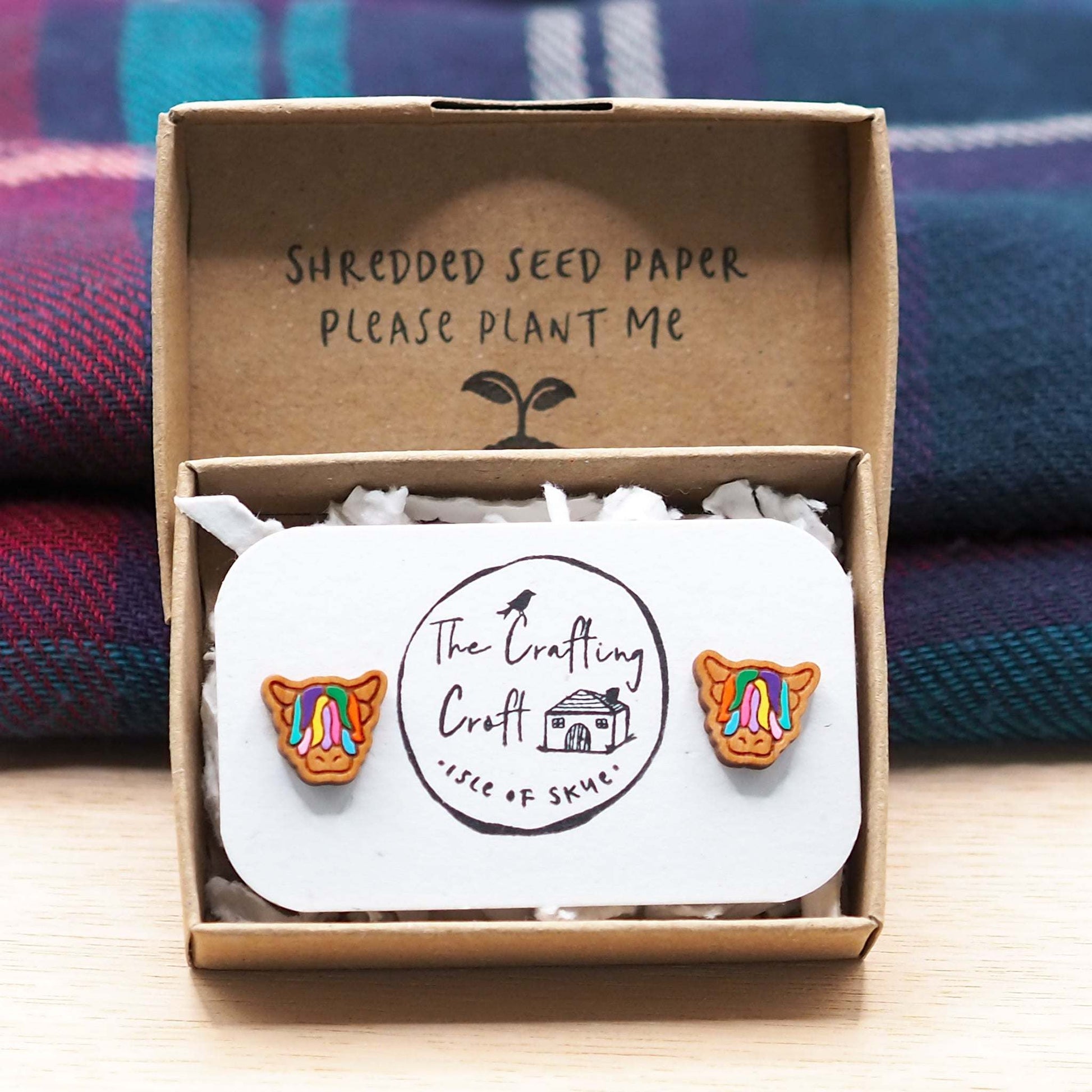 Multi-coloured Highland Cow stud earrings made from cherry wood with surgical steel backs in eco-friendly gift box.