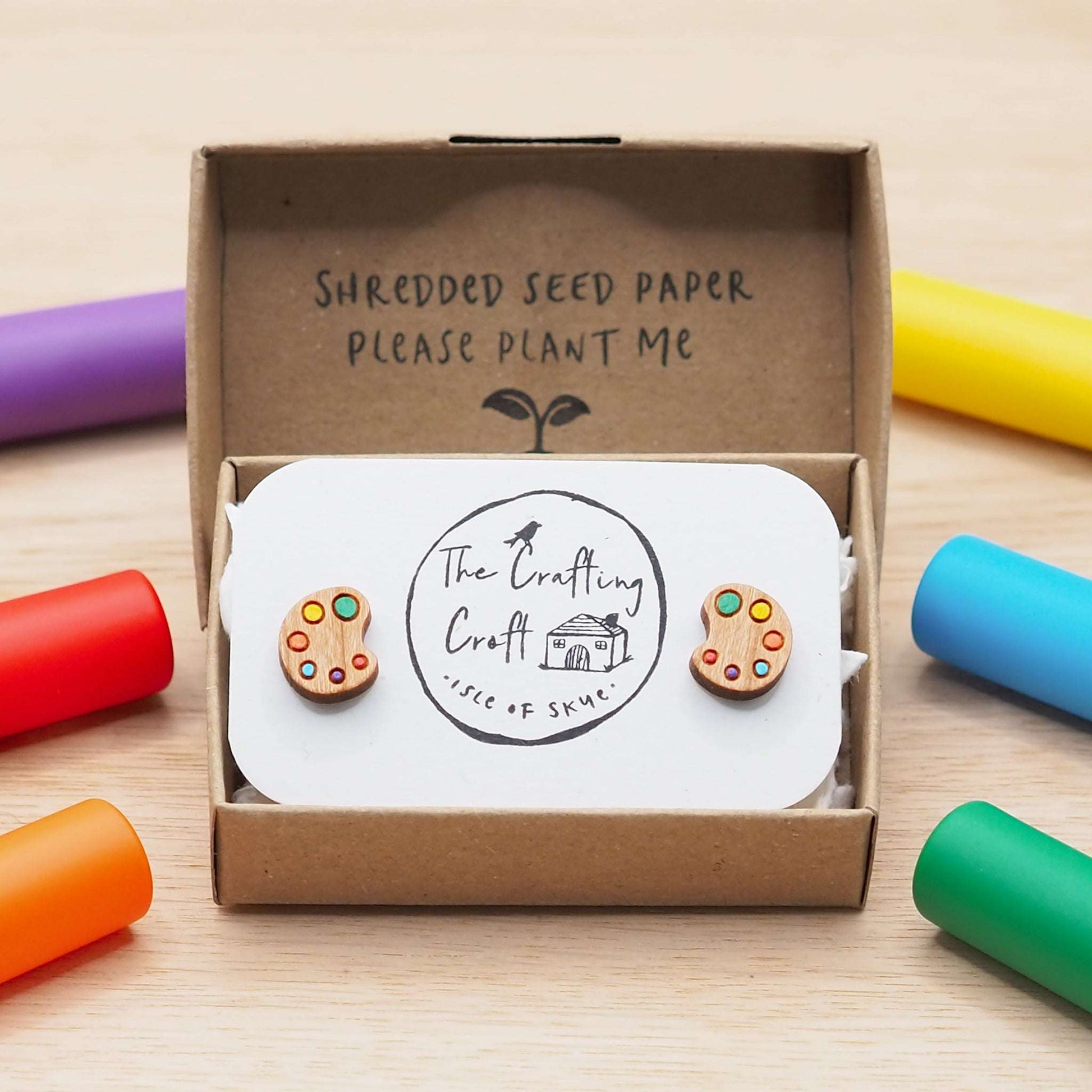 Art palette stud earrings with multicolored design on cherry wood, displayed in eco-friendly gift box.