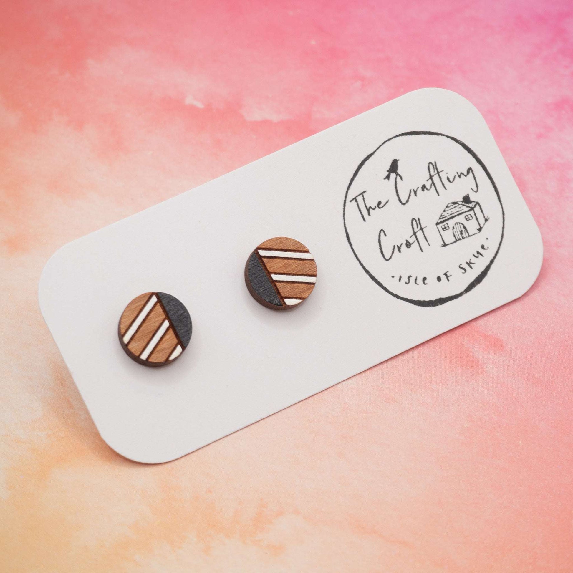 Monochrome geometric painted stud earrings on display card with eco-friendly gift packaging.