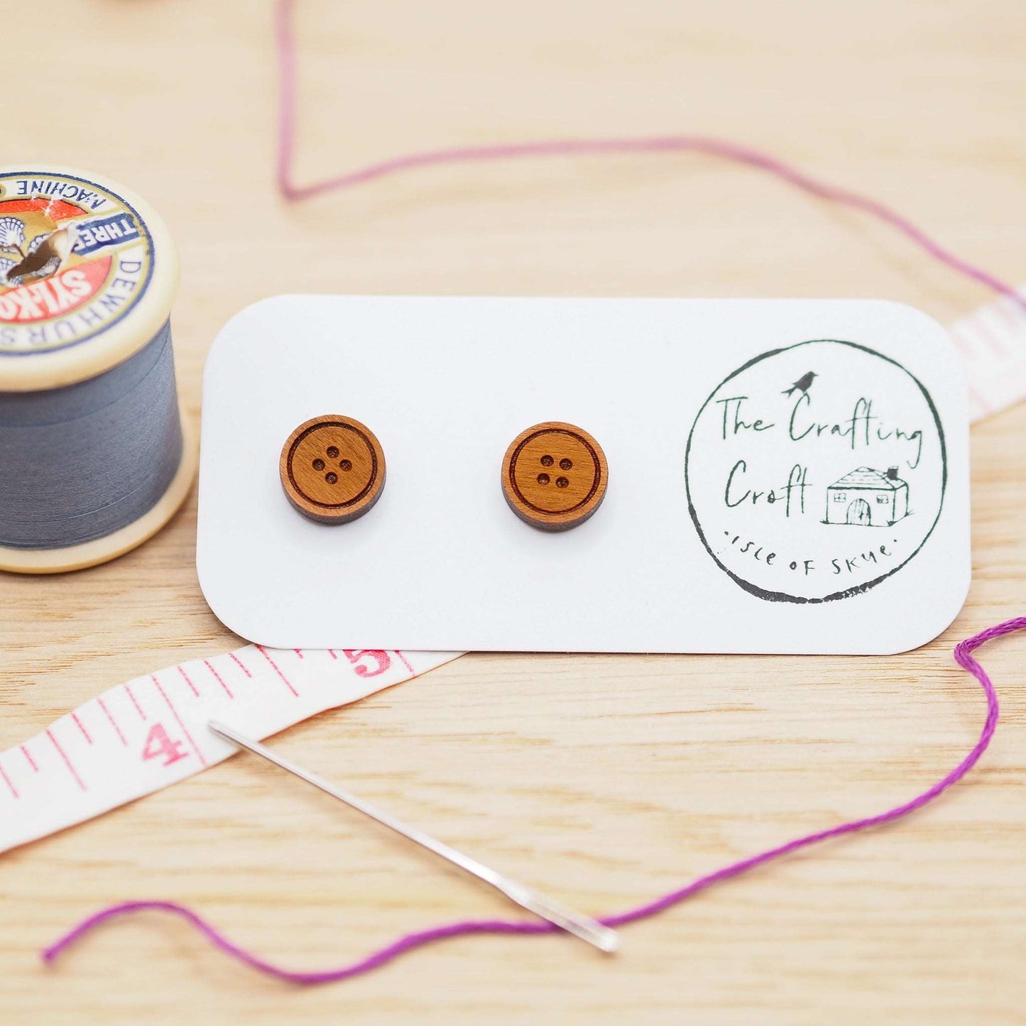 Button stud earrings in solid cherry wood with surgical steel backs, eco-friendly gift box.