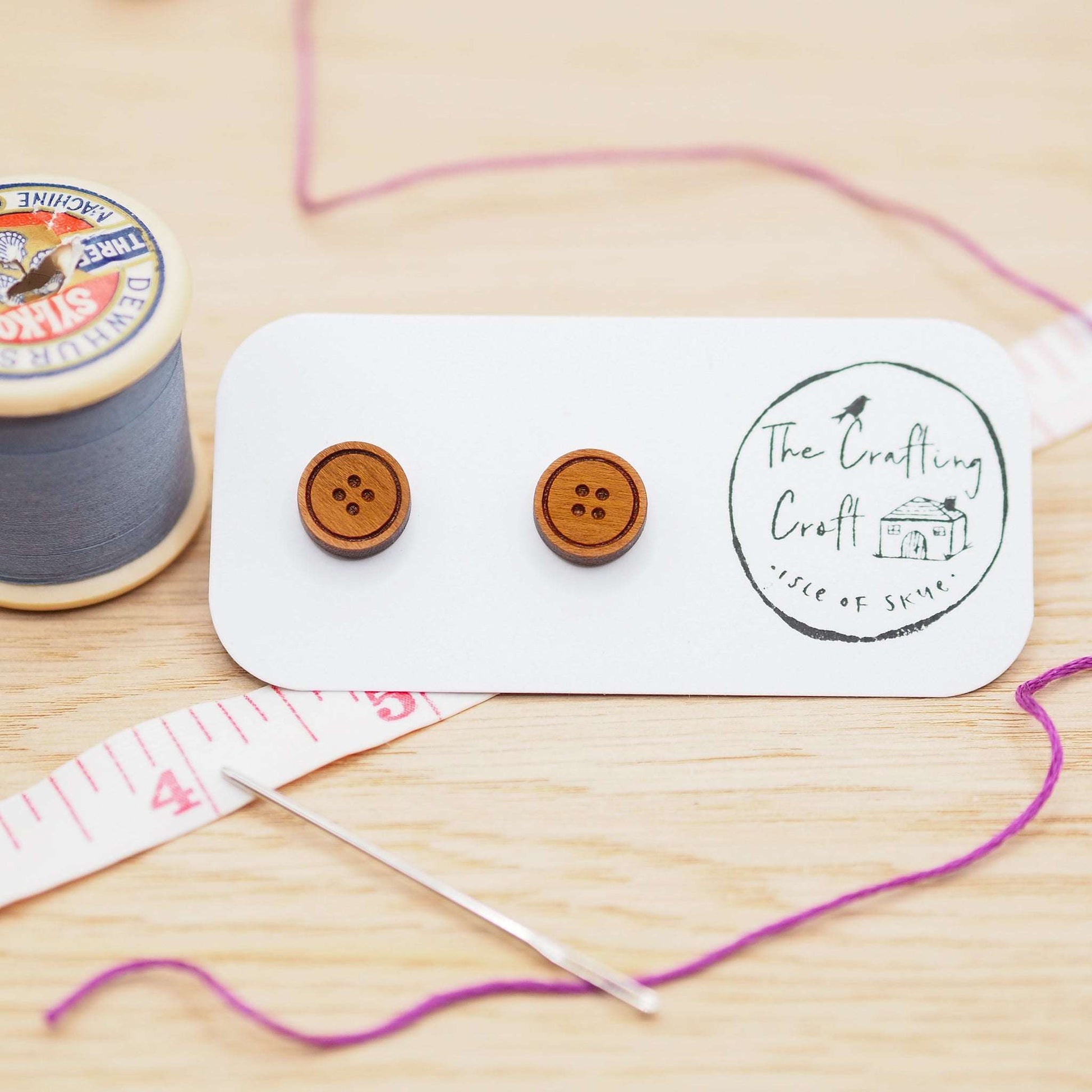 Button stud earrings in solid cherry wood with surgical steel backs, eco-friendly gift box.