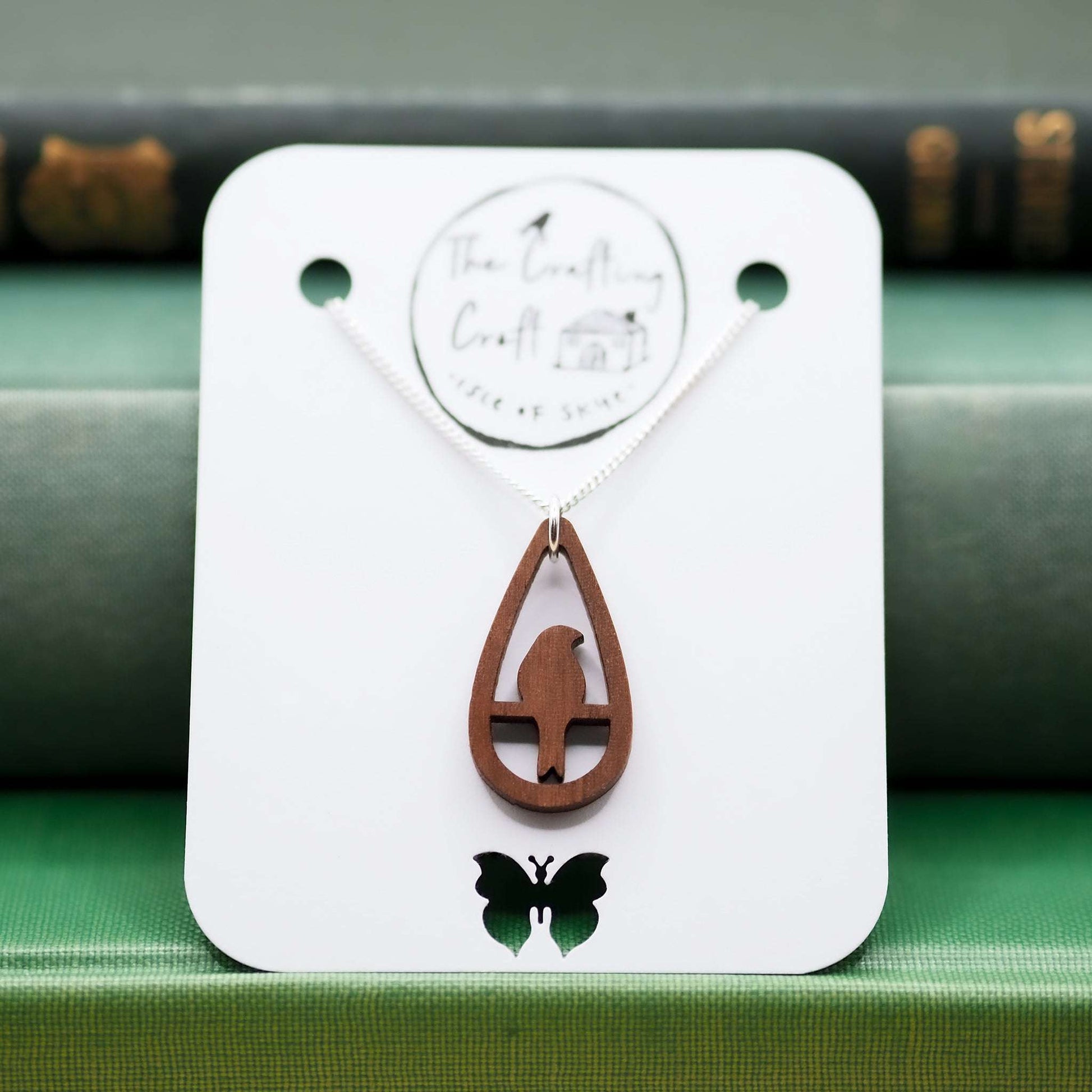 Bird teardrop necklace with walnut wood pendant and recycled sterling silver chain.