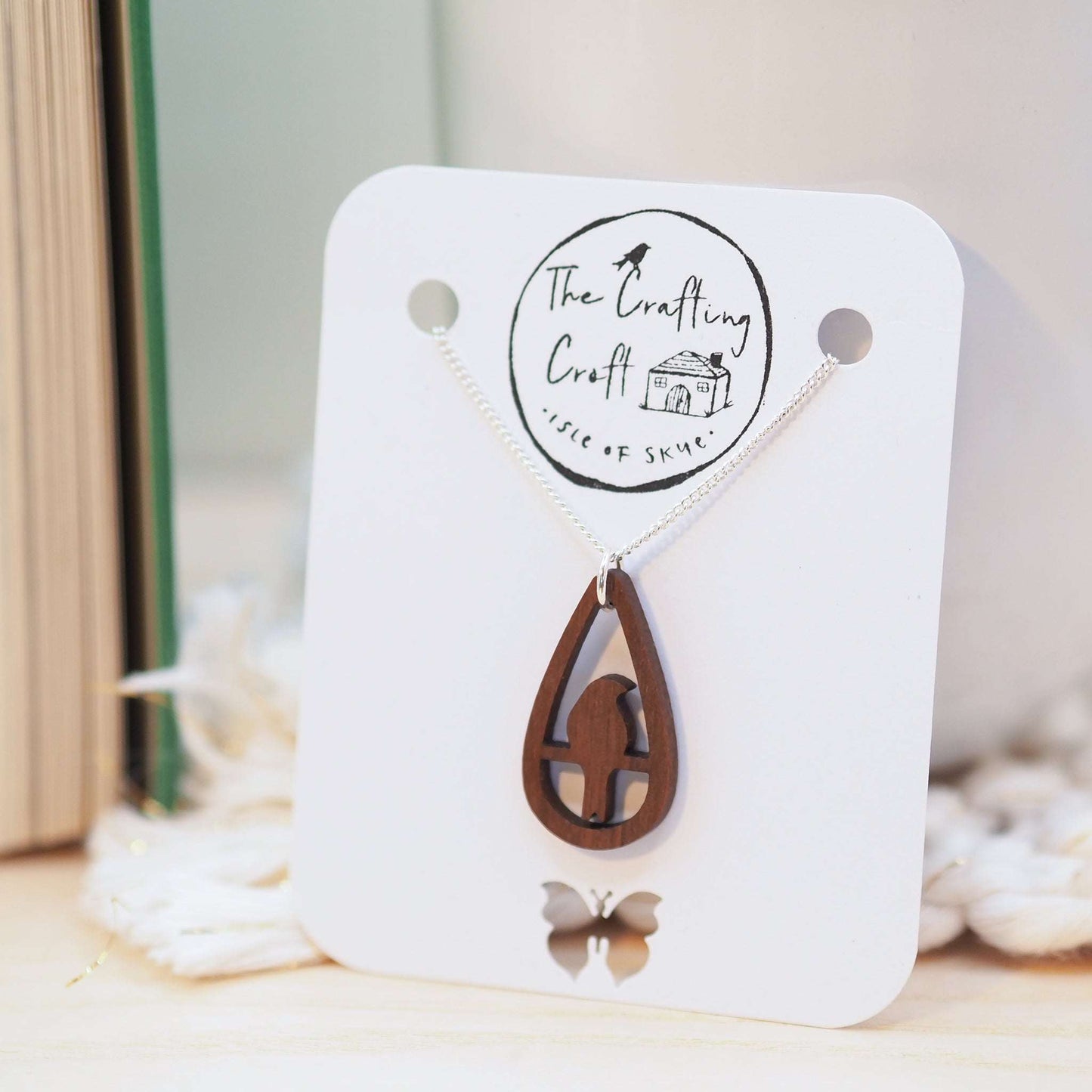 Bird teardrop necklace on recycled silver chain with walnut wood pendant, eco-friendly gift box.