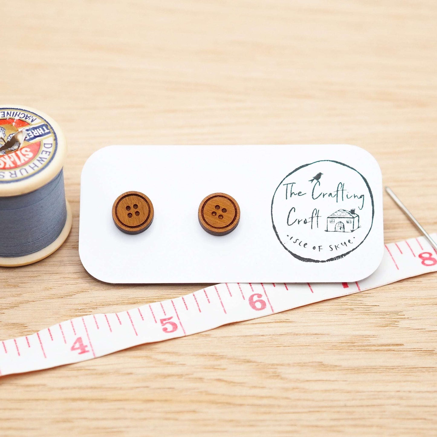 Cherry wood button stud earrings with surgical steel backs, eco-friendly packaging.