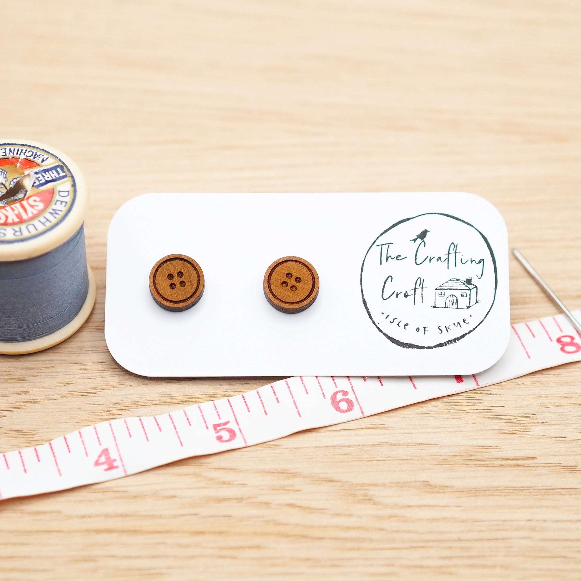 Cherry wood button stud earrings with surgical steel backs, eco-friendly packaging.