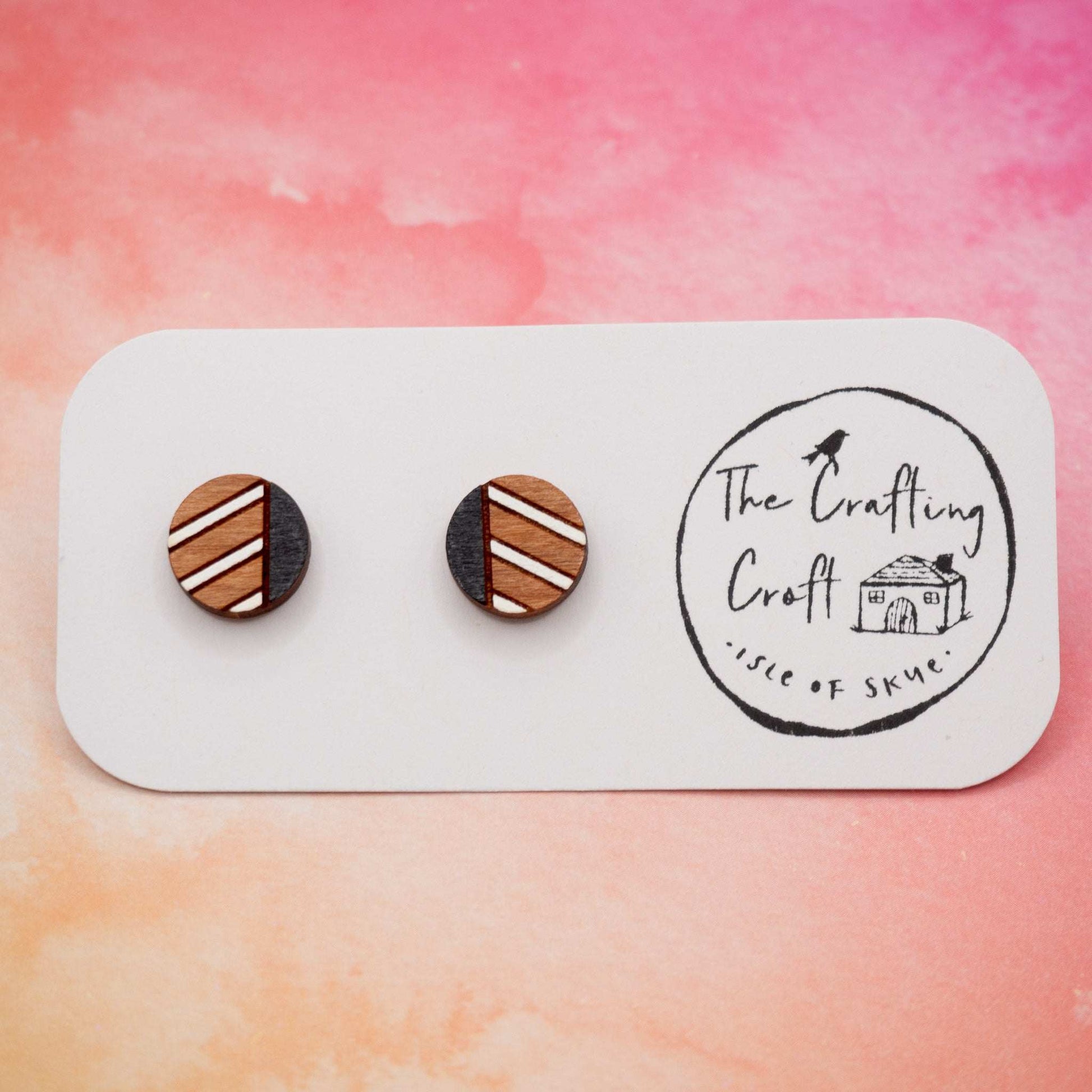 Monochrome geometric painted stud earrings made from sustainable cherry wood with black and white stripe design.