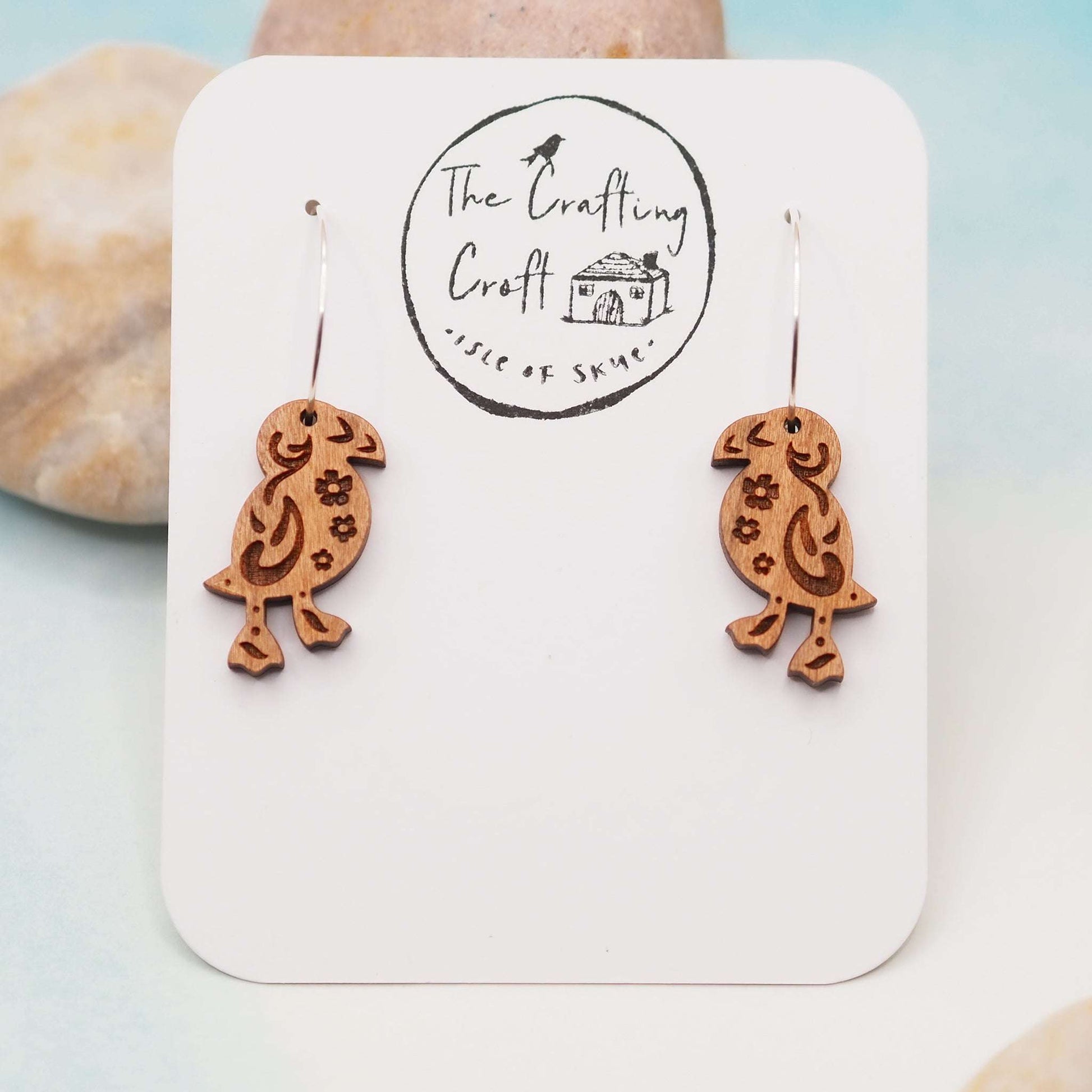 Wooden puffin engraved hoop earrings with sterling silver hoops, eco-friendly gift packaging.