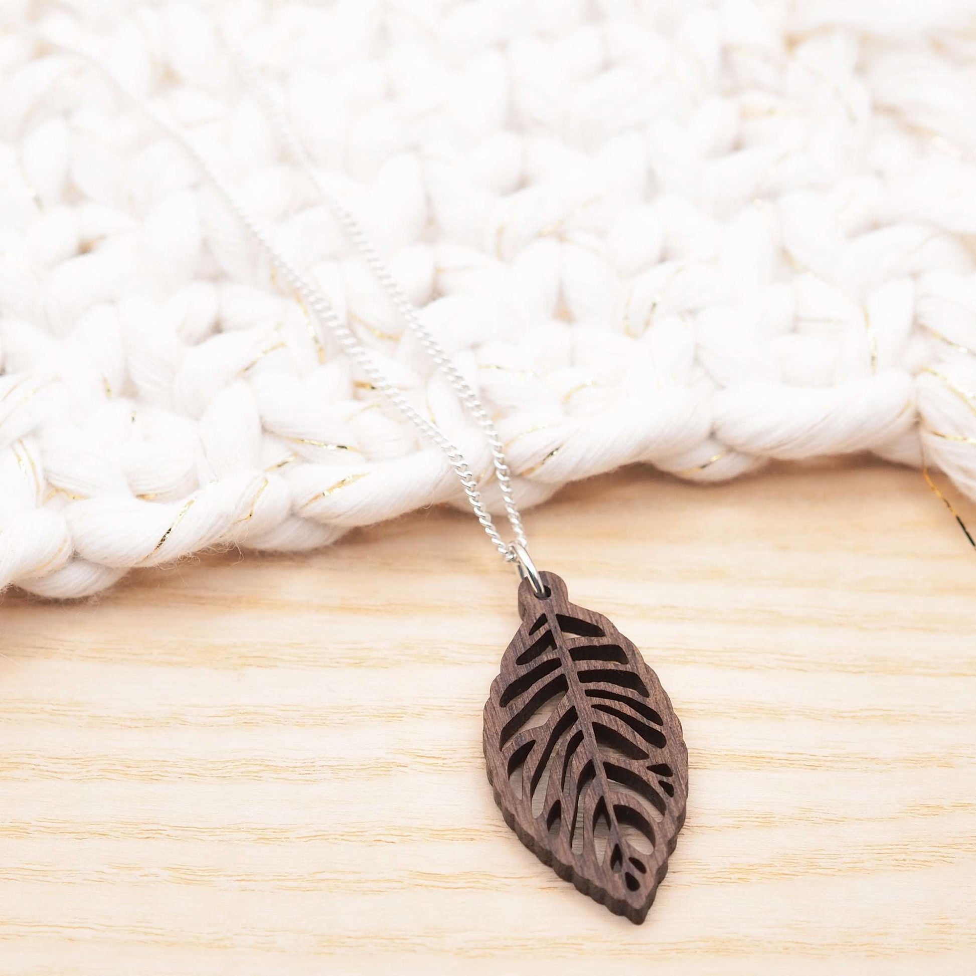 Leaf skeleton necklace made from walnut wood on recycled sterling silver chain.