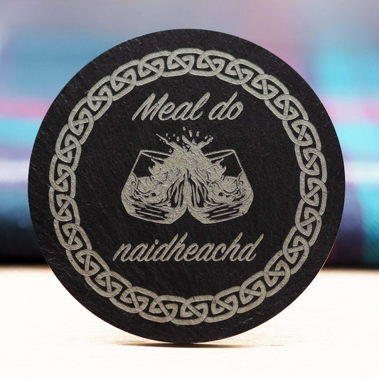 Gaelic congratulations slate coaster with engraved "Meal do naidheachd" and Celtic design.