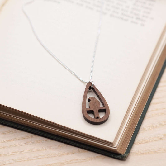 Bird teardrop necklace with walnut wood pendant on sterling silver chain.
