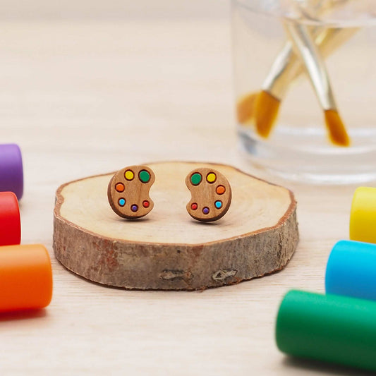 Art palette stud earrings made from cherry wood with multicolored design and surgical steel backs.