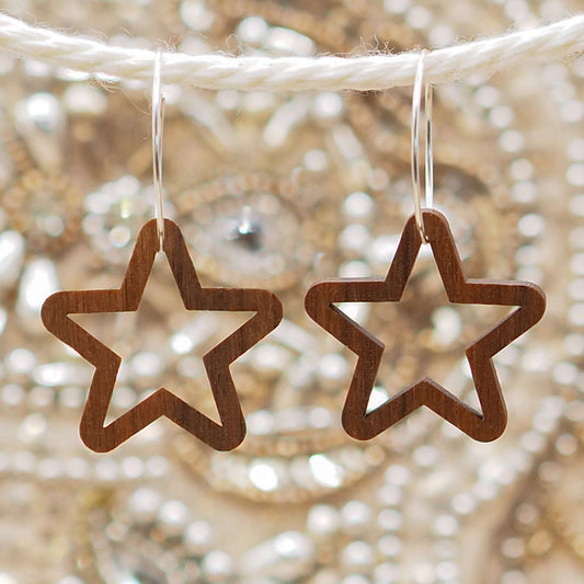 Chunky star hoop earrings made from sustainable walnut wood with sterling silver hoops.