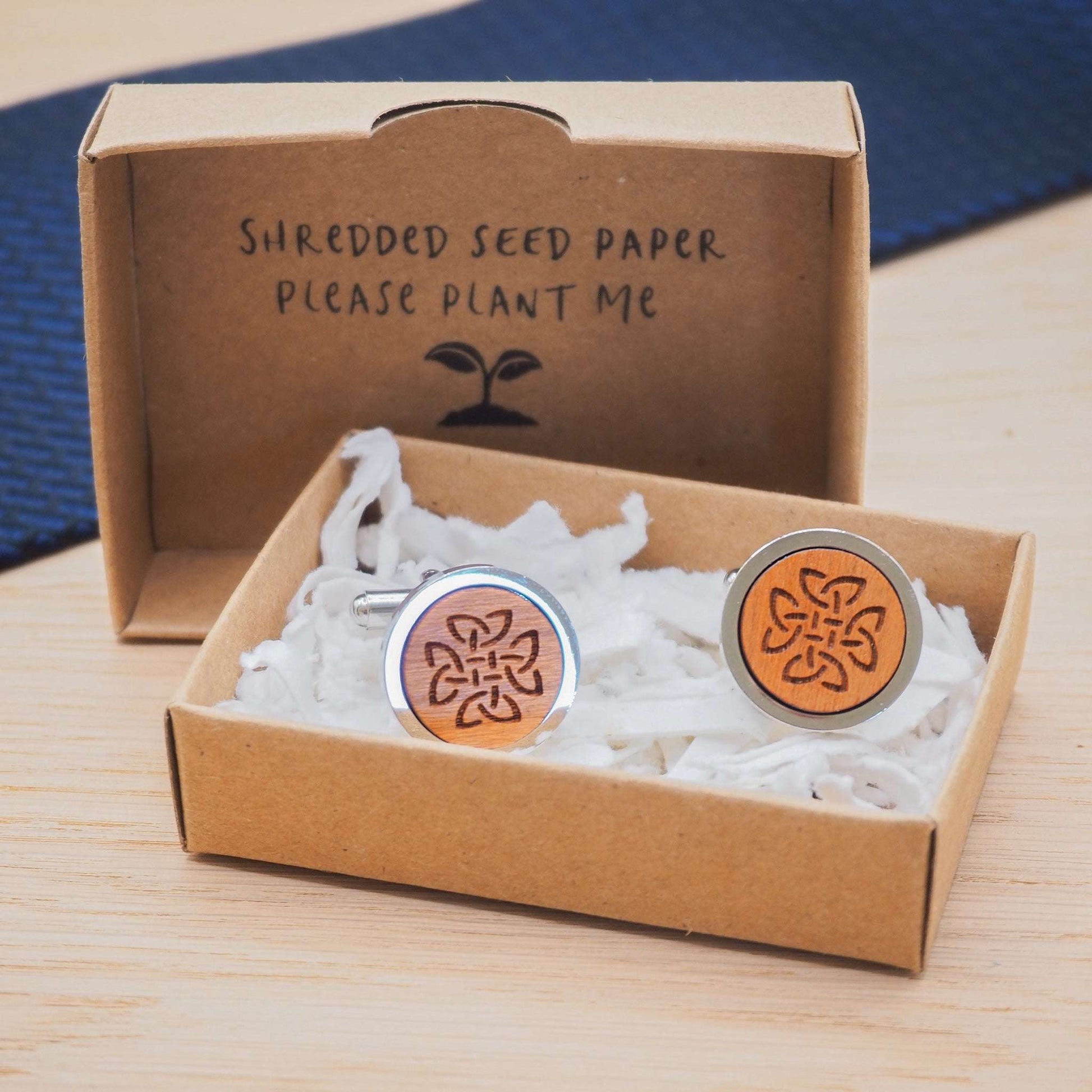 Celtic knot wooden cufflinks in eco-friendly packaging.