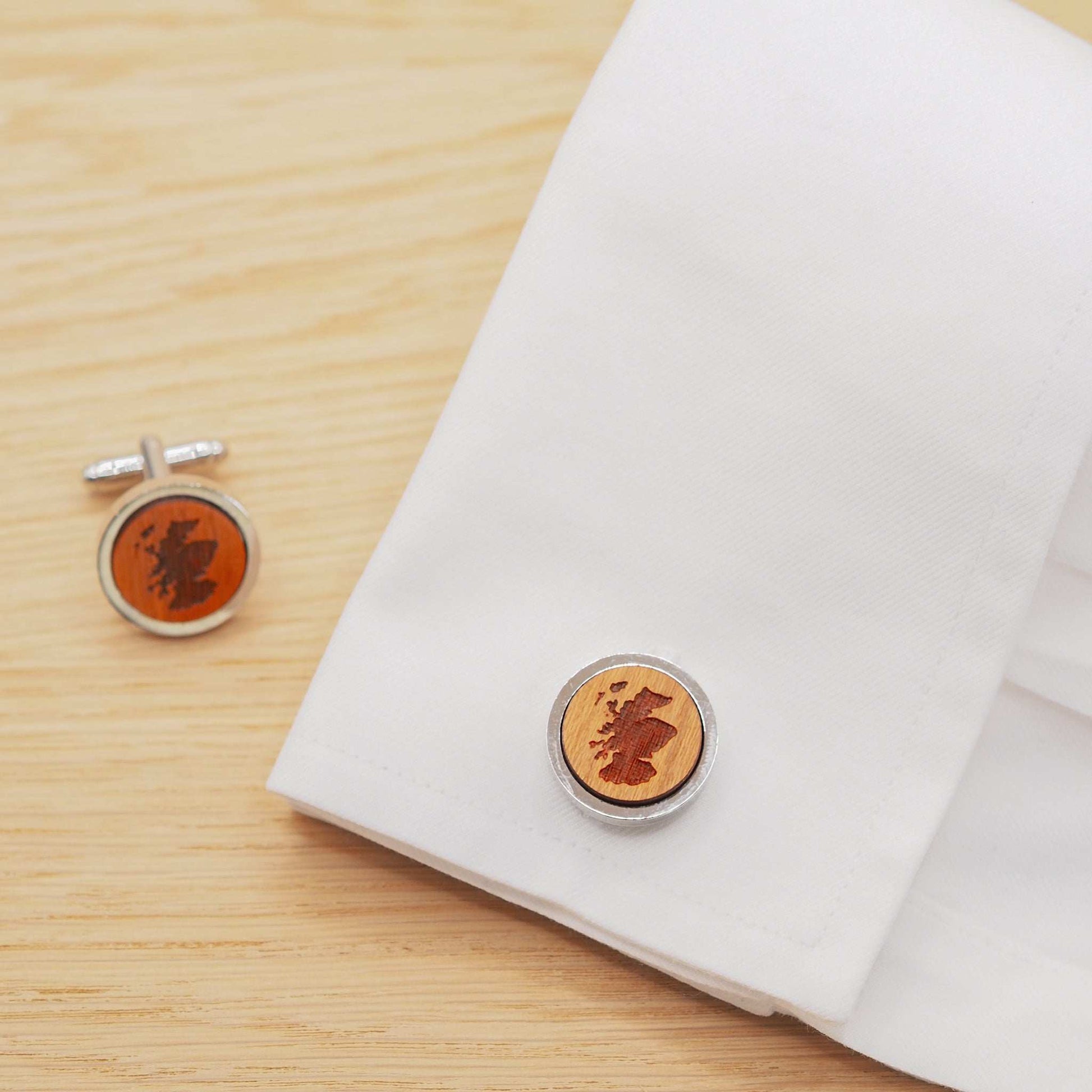 Eco-friendly Scotland outline wooden cufflinks with engraved map design, silver rhodium bezel, and cherry wood detail.